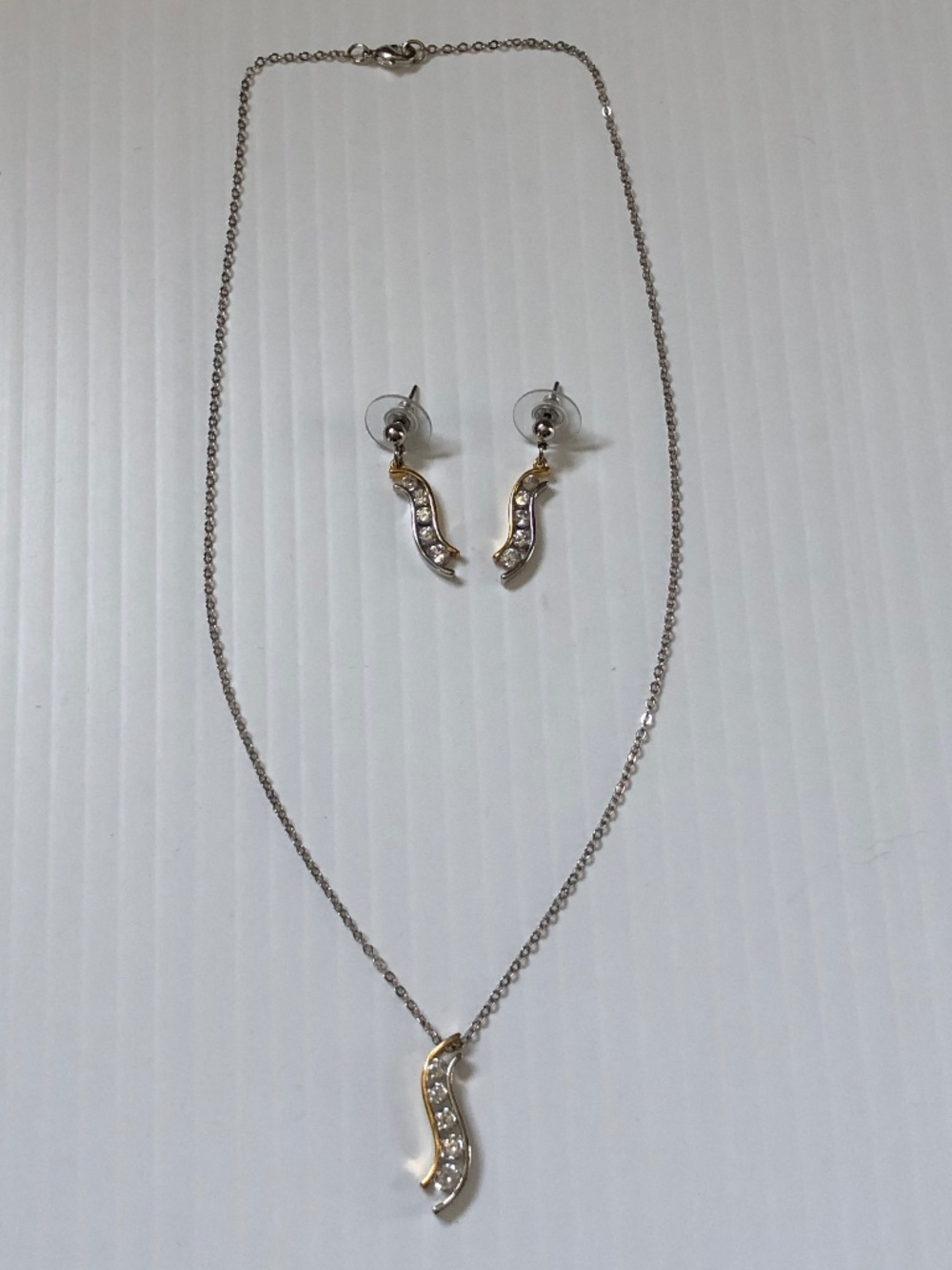 Silver 5 stone cubic zirconia necklace and earrings